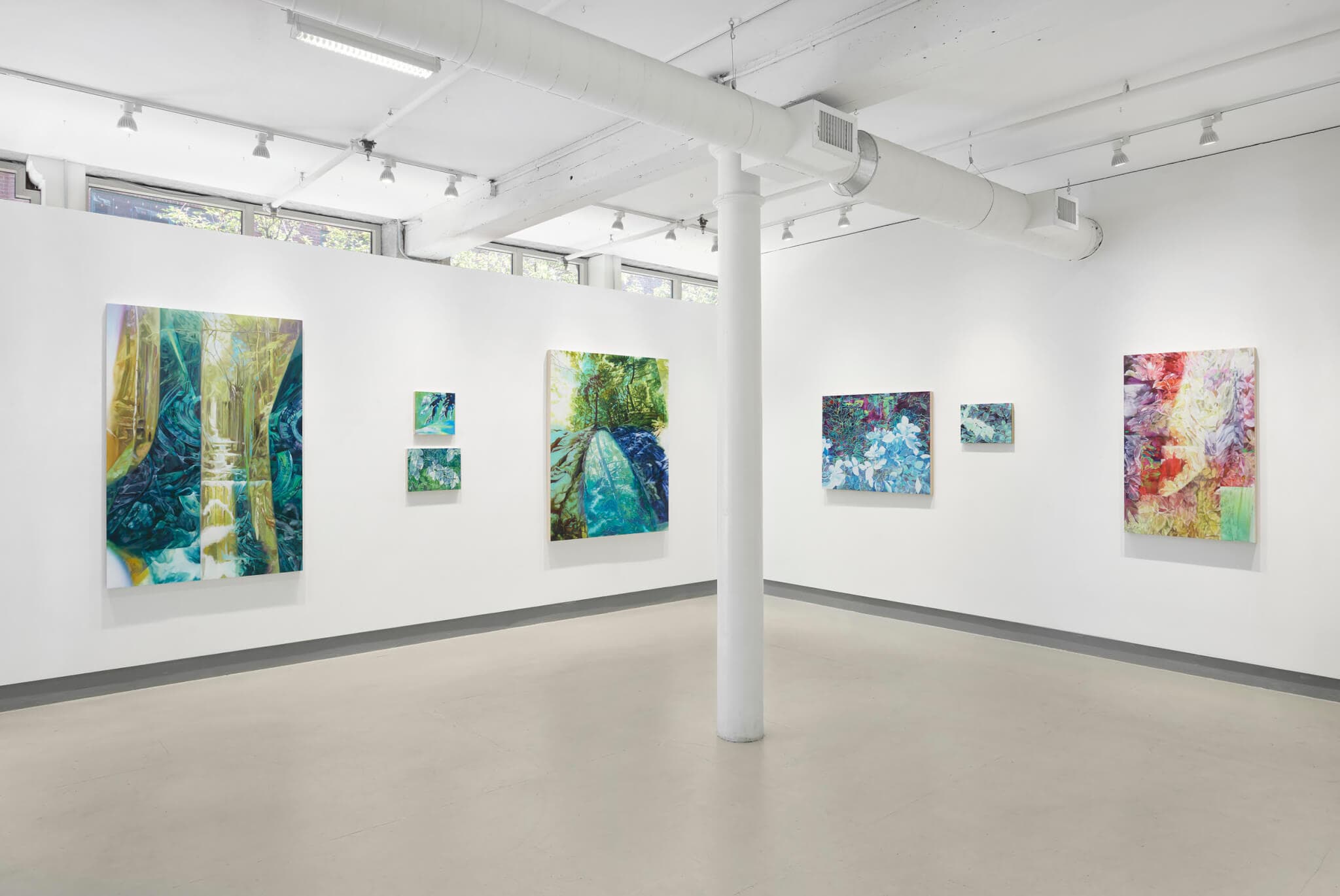 Installation view of the exhibition. The image is of a corner between two walls displaying works of art.